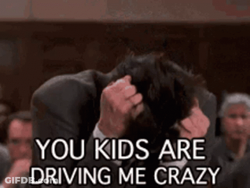 Man In Suit Holding Head Saying You Kids Are Driving Me Crazy GIF