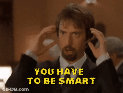 Man In Suit Holding Head You Have To Be Smart GIF