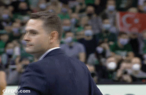 Man In Suit Holding IG Sign GIF