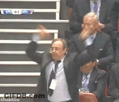Man In Suit Holding Jersey Number 20 GIF