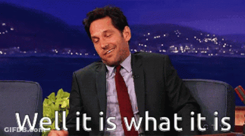 Man In Suit Holding Lettuce Saying Well It Is What It Is GIF