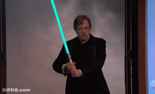 Man In Suit Holding Light Saber GIF