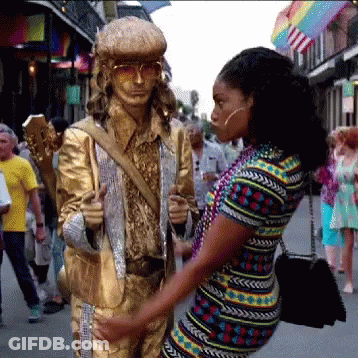 Man In Suit Holding Lollipop GIF
