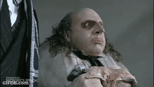 Man In Suit Holding Meat With Fandango Clip GIF