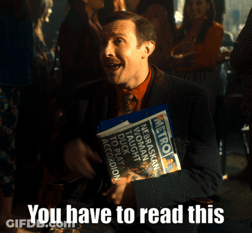 Man In Suit Holding Metro Newspaper GIF