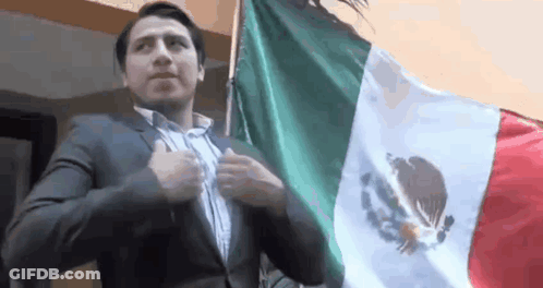 Man In Suit Holding Mexican Flag GIF