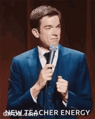 Man In Suit Holding Microphone GIF