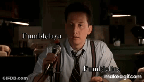 Man In Suit Holding Microphone GIF
