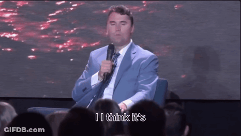 Man In Suit Holding Microphone GIF