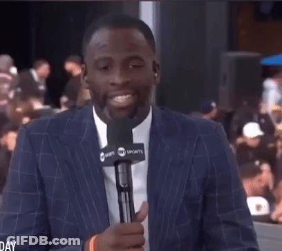 Man In Suit Holding Microphone GIF