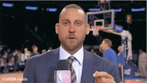 Man In Suit Holding Microphone GIF