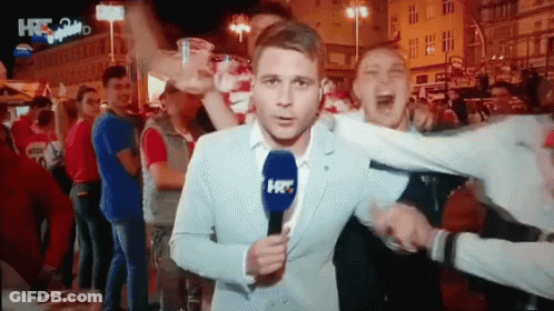 Man In Suit Holding Microphone Saying HR GIF