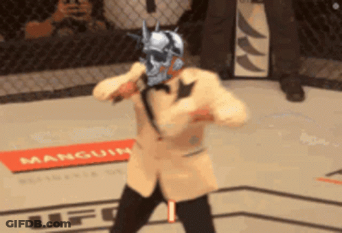 Man In Suit Holding Microphone Saying Its Timeeee GIF