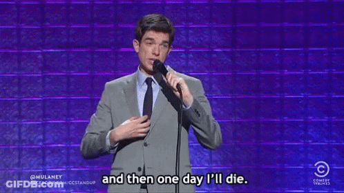Man In Suit Holding Microphone Saying One Day I Will Die GIF