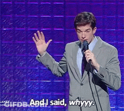 Man In Suit Holding Microphone Saying Whyyy GIF