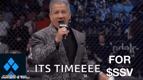 Man In Suit Holding Microphone Says Its Timeeee GIF