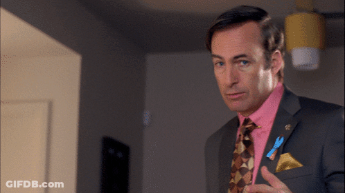 Man In Suit Holding Microphone Talking GIF