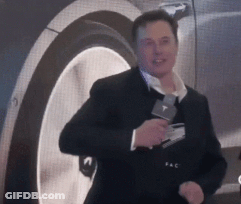 Man In Suit Holding Microphone With T GIF