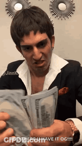 Man In Suit Holding Money GIF
