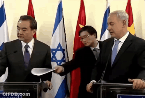 Man In Suit Holding Paper GIF