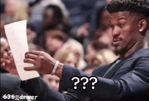 Man In Suit Holding Paper Saying What GIF
