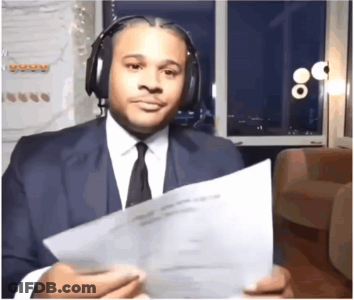 Man In Suit Holding Paper GIF