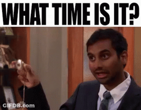 Man In Suit Holding Pendulum Asking Time GIF