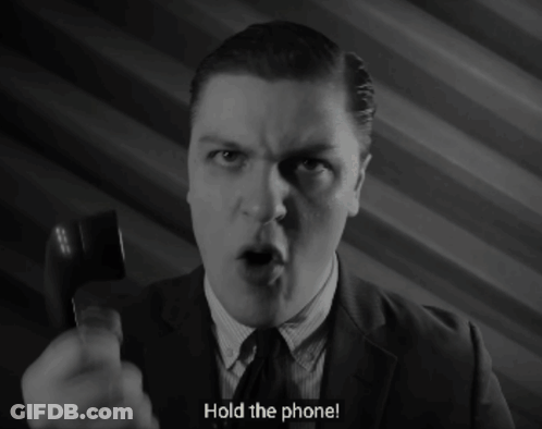Man In Suit Holding Phone GIF