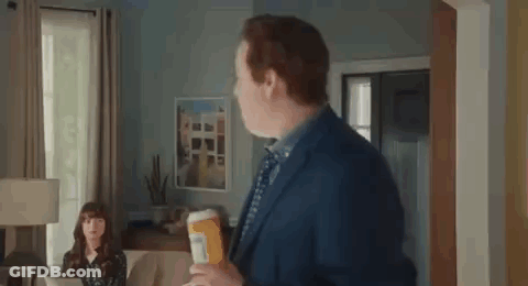 Man In Suit Holding Pills GIF