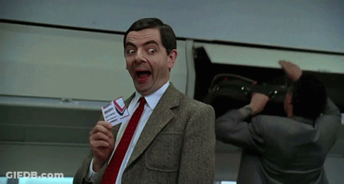 Man In Suit Holding Plane Ticket GIF