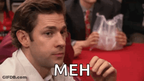Man In Suit Holding Plastic Bag Meh GIF
