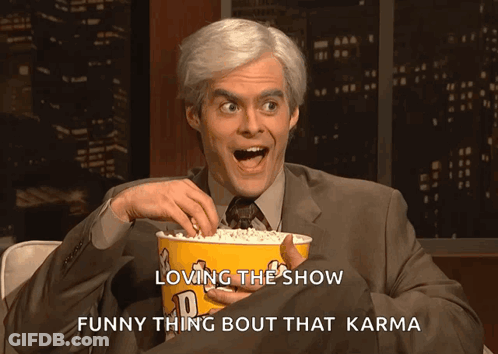 Man In Suit Holding Popcorn Says Loving The Show Funny Thing Bout That Karma GIF