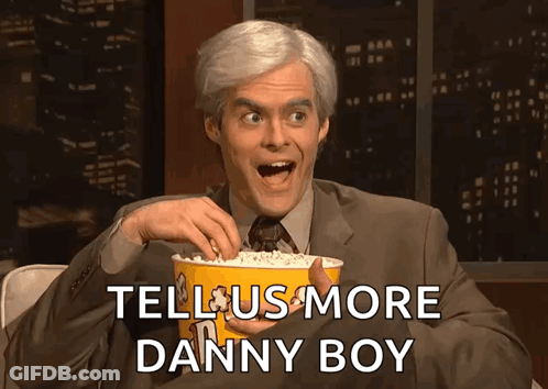 Man In Suit Holding Popcorn Tell Us More Danny Boy GIF