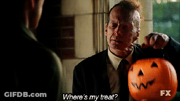 Man In Suit Holding Pumpkin Asking Where's His Treat GIF