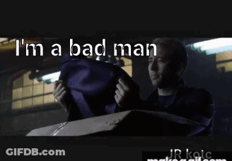 Man In Suit Holding Purple Bag Saying I'm A Bad Man GIF