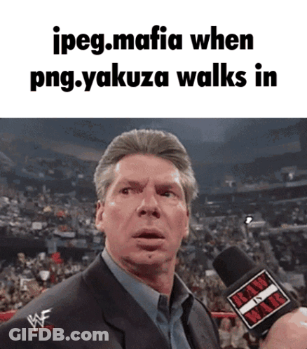 Man In Suit Holding Raw Microphone GIF