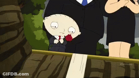 Man In Suit Holding Red Rose GIF