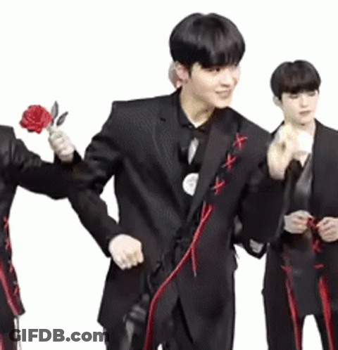 Man In Suit Holding Red Rose GIF