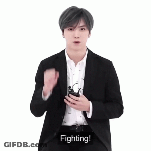 Man In Suit Holding Remote Fighting GIF