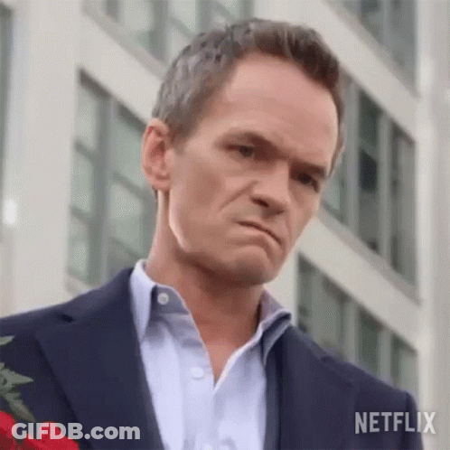 Man In Suit Holding Rose GIF