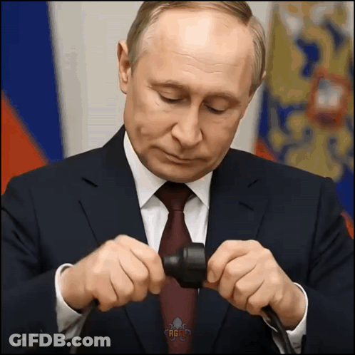 Man In Suit Holding Russia Text GIF