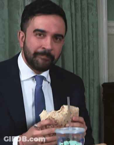 Man In Suit Holding Sandwich And Drink GIF