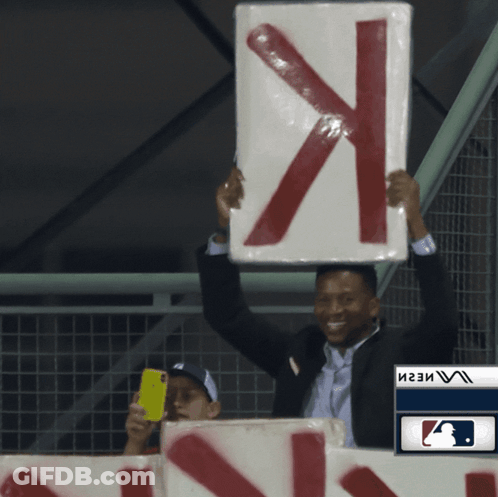 Man In Suit Holding Sign X GIF