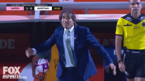 Man In Suit Holding Soccer Ball Fox Deportes Ad GIF