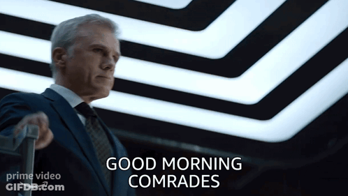 Man In Suit Holding Suitcase Saying Good Morning Comrades GIF