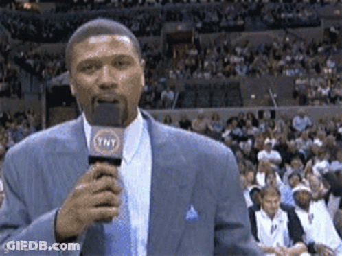 Man In Suit Holding TNT Microphone GIF