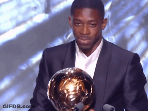 Man In Suit Holding Trophy GIF