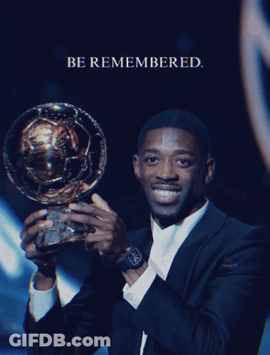 Man In Suit Holding Trophy Be Remembered GIF