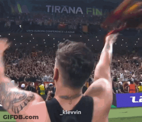 Man In Suit Holding Trophy Saying Emerging Player Of The Year Desiré Doué GIF