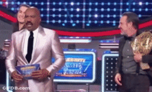 Man In Suit Holding Trophy With Security Sign GIF